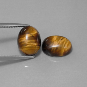 Tiger's Eye طبيعي بلون بني ذهبي، وزن ‎‎ قيراط، شكل بيضاوى، مقاس ‎9x7‎ مم