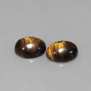 Tiger's Eye طبيعي بلون بني ذهبي، وزن ‎‎ قيراط، شكل بيضاوى، مقاس ‎8.8x6.9‎ مم