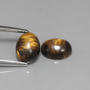 Tiger's Eye طبيعي بلون بني ذهبي، وزن ‎‎ قيراط، شكل بيضاوى، مقاس ‎8.8x6.9‎ مم