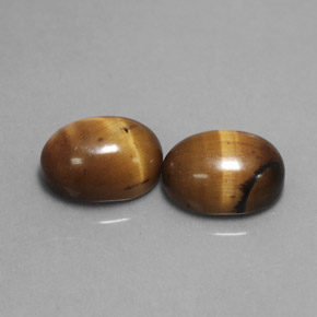 Tiger's Eye طبيعي بلون بني ذهبي، وزن ‎‎ قيراط، شكل بيضاوى، مقاس ‎9x7‎ مم