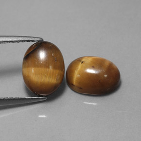 Tiger's Eye طبيعي بلون بني ذهبي، وزن ‎‎ قيراط، شكل بيضاوى، مقاس ‎9x7‎ مم