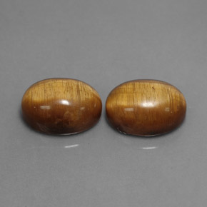 Tiger's Eye طبيعي بلون بني ذهبي، وزن ‎‎ قيراط، شكل بيضاوى، مقاس ‎8.9x6.9‎ مم