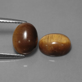 Tiger's Eye طبيعي بلون بني ذهبي، وزن ‎‎ قيراط، شكل بيضاوى، مقاس ‎8.9x6.9‎ مم