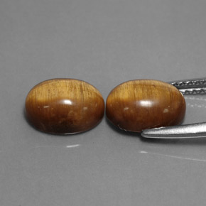 Tiger's Eye طبيعي بلون بني ذهبي، وزن ‎‎ قيراط، شكل بيضاوى، مقاس ‎8.9x6.9‎ مم