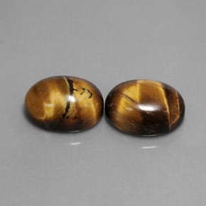 Tiger's Eye طبيعي بلون بني ذهبي، وزن ‎‎ قيراط، شكل بيضاوى، مقاس ‎9x7‎ مم