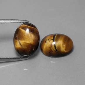 Tiger's Eye طبيعي بلون بني ذهبي، وزن ‎‎ قيراط، شكل بيضاوى، مقاس ‎9x7‎ مم
