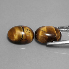 Tiger's Eye طبيعي بلون بني ذهبي، وزن ‎‎ قيراط، شكل بيضاوى، مقاس ‎9x7‎ مم