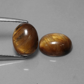 Tiger's Eye طبيعي بلون بني ذهبي، وزن ‎‎ قيراط، شكل بيضاوى، مقاس ‎9x7‎ مم