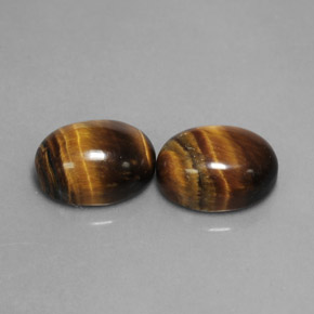 Tiger's Eye طبيعي بلون بني ذهبي، وزن ‎‎ قيراط، شكل بيضاوى، مقاس ‎9x7‎ مم
