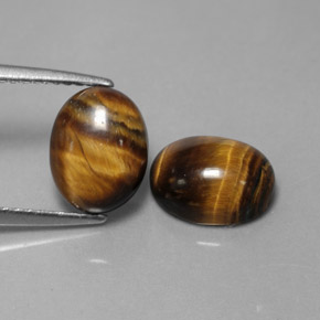 Tiger's Eye طبيعي بلون بني ذهبي، وزن ‎‎ قيراط، شكل بيضاوى، مقاس ‎9x7‎ مم