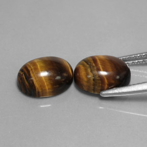 Tiger's Eye طبيعي بلون بني ذهبي، وزن ‎‎ قيراط، شكل بيضاوى، مقاس ‎9x7‎ مم