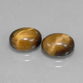 Tiger's Eye طبيعي بلون بني ذهبي، وزن ‎‎ قيراط، شكل بيضاوى، مقاس ‎9x7‎ مم