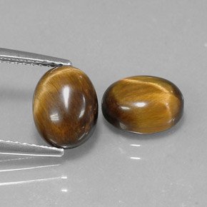 Tiger's Eye طبيعي بلون بني ذهبي، وزن ‎‎ قيراط، شكل بيضاوى، مقاس ‎9x7‎ مم