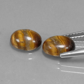Tiger's Eye طبيعي بلون بني ذهبي، وزن ‎‎ قيراط، شكل بيضاوى، مقاس ‎8.9x6.8‎ مم