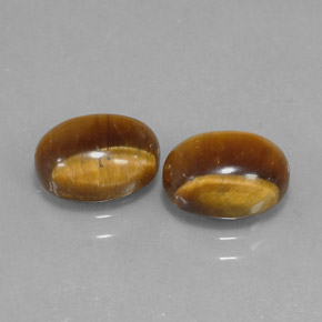 Tiger's Eye طبيعي بلون بني ذهبي، وزن ‎‎ قيراط، شكل بيضاوى، مقاس ‎8.9x6.9‎ مم
