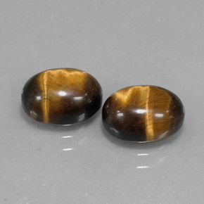 Tiger's Eye طبيعي بلون بني ذهبي، وزن ‎‎ قيراط، شكل بيضاوى، مقاس ‎9.1x7.1‎ مم