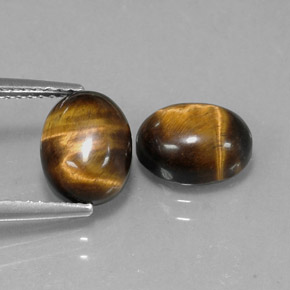 Tiger's Eye طبيعي بلون بني ذهبي، وزن ‎‎ قيراط، شكل بيضاوى، مقاس ‎9.1x7.1‎ مم