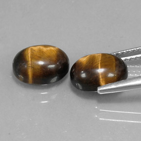 Tiger's Eye طبيعي بلون بني ذهبي، وزن ‎‎ قيراط، شكل بيضاوى، مقاس ‎9.1x7.1‎ مم