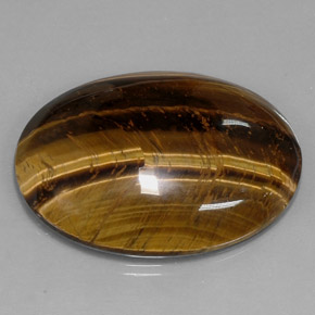 Tiger's Eye طبيعي بلون بني ذهبي، وزن ‎73.05‎ قيراط، شكل بيضاوى، مقاس ‎39.8x24.1‎ مم