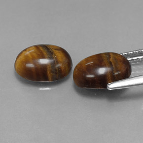 Tiger's Eye طبيعي بلون بني ذهبي، وزن ‎‎ قيراط، شكل بيضاوى، مقاس ‎8.8x6.8‎ مم