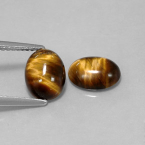Tiger's Eye طبيعي بلون بني ذهبي، وزن ‎‎ قيراط، شكل بيضاوى، مقاس ‎8.6x6.6‎ مم