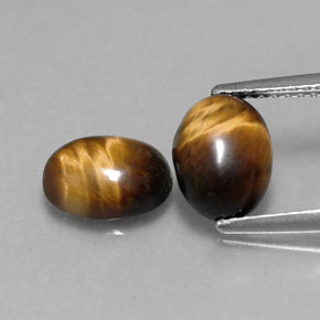 Tiger's Eye طبيعي بلون بني ذهبي، وزن ‎‎ قيراط، شكل بيضاوى، مقاس ‎8.7x6.8‎ مم