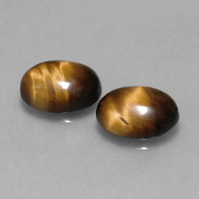 Tiger's Eye طبيعي بلون بني ذهبي، وزن ‎‎ قيراط، شكل بيضاوى، مقاس ‎8.7x6.8‎ مم