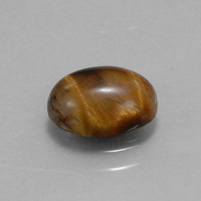 Tiger's Eye طبيعي بلون بني ذهبي، وزن ‎1.55‎ قيراط، شكل بيضاوى، مقاس ‎8.8x6.8‎ مم