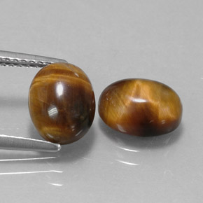 Tiger's Eye طبيعي بلون بني ذهبي، وزن ‎‎ قيراط، شكل بيضاوى، مقاس ‎9.1x7‎ مم
