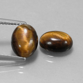 Tiger's Eye طبيعي بلون بني ذهبي، وزن ‎‎ قيراط، شكل بيضاوى، مقاس ‎9x7‎ مم