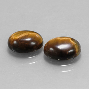 Tiger's Eye طبيعي بلون بني ذهبي، وزن ‎‎ قيراط، شكل بيضاوى، مقاس ‎9x7‎ مم