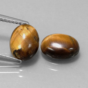 Tiger's Eye طبيعي بلون بني ذهبي، وزن ‎‎ قيراط، شكل بيضاوى، مقاس ‎9x7‎ مم