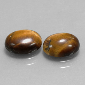 Tiger's Eye طبيعي بلون بني ذهبي، وزن ‎‎ قيراط، شكل بيضاوى، مقاس ‎9x7‎ مم