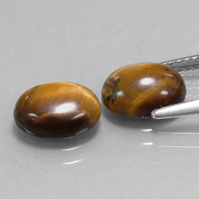 Tiger's Eye طبيعي بلون بني ذهبي، وزن ‎‎ قيراط، شكل بيضاوى، مقاس ‎9x7‎ مم