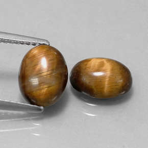 Tiger's Eye طبيعي بلون بني ذهبي، وزن ‎‎ قيراط، شكل بيضاوى، مقاس ‎8.7x6.7‎ مم