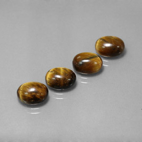 Tiger's Eye طبيعي بلون بني ذهبي، وزن ‎‎ قيراط، شكل بيضاوى، مقاس ‎9x7‎ مم