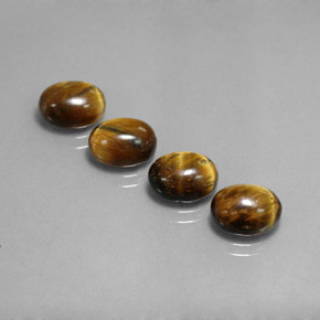 Tiger's Eye طبيعي بلون بني ذهبي، وزن ‎‎ قيراط، شكل بيضاوى، مقاس ‎9x7‎ مم