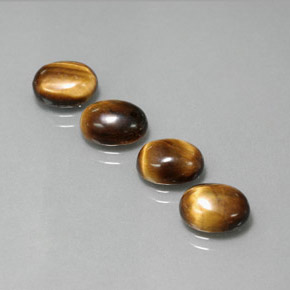 Tiger's Eye طبيعي بلون بني ذهبي، وزن ‎‎ قيراط، شكل بيضاوى، مقاس ‎8.8x6.8‎ مم