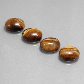 Tiger's Eye طبيعي بلون بني ذهبي، وزن ‎‎ قيراط، شكل بيضاوى، مقاس ‎9x7‎ مم
