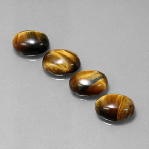Tiger's Eye طبيعي بلون بني ذهبي، وزن ‎‎ قيراط، شكل بيضاوى، مقاس ‎8.9x6.9‎ مم