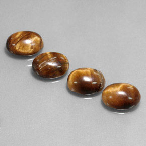 Tiger's Eye طبيعي بلون بني ذهبي، وزن ‎‎ قيراط، شكل بيضاوى، مقاس ‎8.8x6.9‎ مم