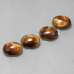 Tiger's Eye طبيعي بلون بني ذهبي، وزن ‎‎ قيراط، شكل بيضاوى، مقاس ‎8.8x6.9‎ مم