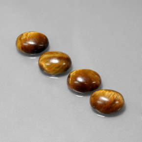 Tiger's Eye طبيعي بلون بني ذهبي، وزن ‎‎ قيراط، شكل بيضاوى، مقاس ‎8.8x6.9‎ مم