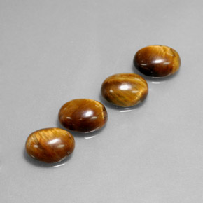 Tiger's Eye طبيعي بلون بني ذهبي، وزن ‎‎ قيراط، شكل بيضاوى، مقاس ‎8.8x6.9‎ مم