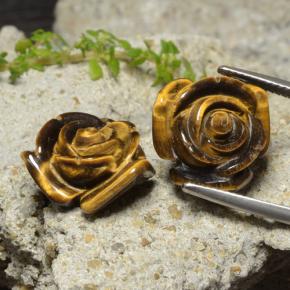 Tiger's Eye طبيعي بلون بنى دافئ، وزن ‎24.14‎ قيراط، شكل قطع زهرة، مقاس ‎16.1x15.2‎ مم