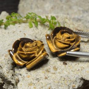 Tiger's Eye طبيعي بلون بنى دافئ، وزن ‎24.14‎ قيراط، شكل قطع زهرة، مقاس ‎16.1x15.2‎ مم