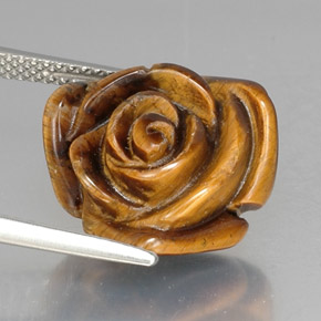 Tiger's Eye طبيعي بلون بني ذهبي، وزن ‎10.53‎ قيراط، شكل شكل خيالي، مقاس ‎15.6x15.1‎ مم