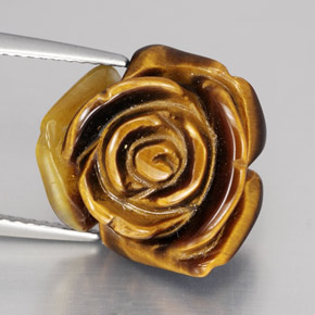 Tiger's Eye طبيعي بلون بني ذهبي، وزن ‎11.74‎ قيراط، شكل شكل خيالي، مقاس ‎15.5x14.6‎ مم