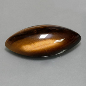 Tiger's Eye طبيعي بلون بني ذهبي، وزن ‎13.60‎ قيراط، شكل ماركيز، مقاس ‎25x12.2‎ مم