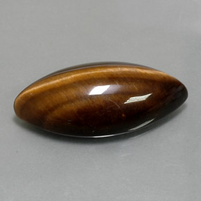 Tiger's Eye طبيعي بلون بني ذهبي، وزن ‎12.55‎ قيراط، شكل ماركيز، مقاس ‎24.4x11.8‎ مم
